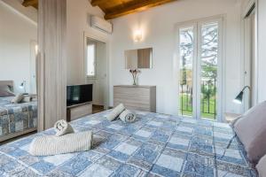 A bed or beds in a room at Dimora Villa Ada