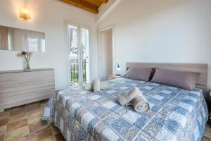 A bed or beds in a room at Dimora Villa Ada