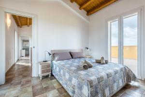 A bed or beds in a room at Dimora Villa Ada
