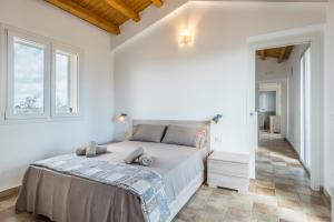A bed or beds in a room at Dimora Villa Ada