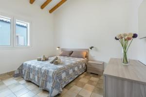 A bed or beds in a room at Dimora Villa Ada