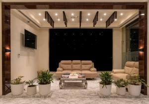 a living room with a couch and two chairs at Cygnett Lite in Alwar