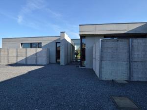 a large concrete building with a large entrance at Modern Dalhem Villa with Views in Dalhem