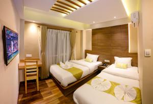 A bed or beds in a room at Hotel Bihani