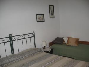 Postel nebo postele na pokoji v ubytování B&B Domus Gaetani