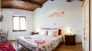 A bed or beds in a room at Il Gladiolo
