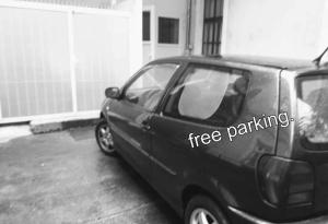 a black car parked in a parking lot at Studio Gizella in Budapest