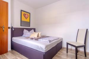 Letto o letti in una camera di Ferienwohnung Agerblick 3 Zimmer mit Küche, 83m2