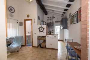 a kitchen with a counter and a refrigerator in a room at The Captain's House in Monterosso al Mare