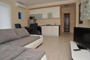 Kuchyň nebo kuchyňský kout v ubytování Apartments Mianiko