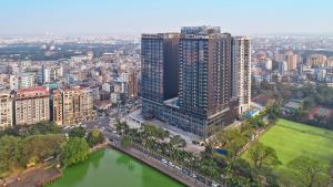 an aerial view of a city with a large building at Wyndham Grand Yangon in Yangon