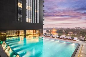a view of a large swimming pool in a building at Wyndham Grand Yangon in Yangon