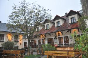 a building with benches in front of it at Bauer & Wirt Langthaler in Emmersdorf an der Donau