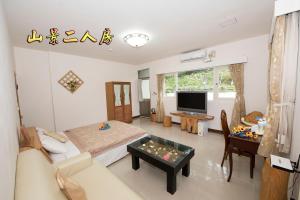 TV a/nebo společenská místnost v ubytování Ez Bay Homestay