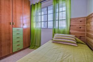 Ein Bett oder Betten in einem Zimmer der Unterkunft Memorable Holidays With Your Family