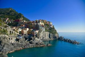a view of a mountain with houses on it at Appartamenti Da Paulin in Manarola