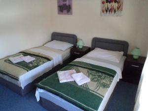 Postel nebo postele na pokoji v ubytování Hotel Le Village