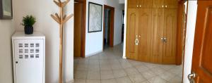 a room with a hallway with a door and a room with a hallway at Apartment Blue Bay in Malinska