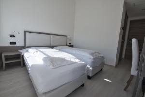 Postel nebo postele na pokoji v ubytování Hotel Garnì Villa Fontana