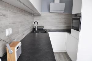 Kuchyňa alebo kuchynka v ubytovaní Kościuszki 28 A by Homeprime