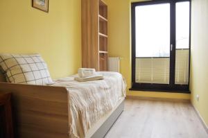 Posteľ alebo postele v izbe v ubytovaní Kościuszki 28 A by Homeprime