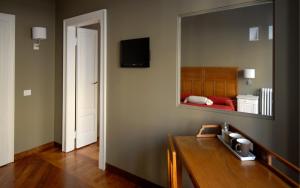 TV a/nebo společenská místnost v ubytování B&B Residenza Cavour
