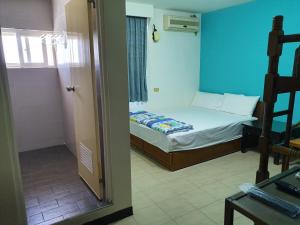 Katil atau katil-katil dalam bilik di Ju Tong Homestay