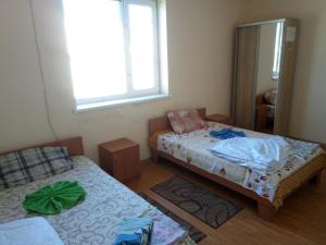 Postel nebo postele na pokoji v ubytování Hotel Uyut
