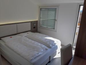 Postel nebo postele na pokoji v ubytování Hotel Garnì Villa Fontana