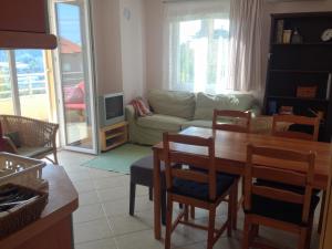 a living room with a table and a couch at Premantura,Natura,Rt Kamenjak in Premantura