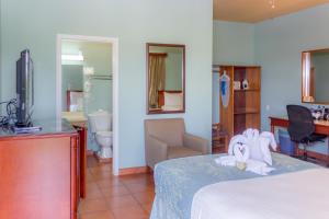 Postel nebo postele na pokoji v ubytování Rolson Hotel