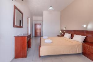 Llit o llits en una habitació de Arilla Beach Hotel