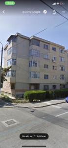 a large building on the side of a street at Apartament Port Turistic Mangalia in Mangalia