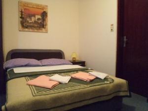 Postel nebo postele na pokoji v ubytování Hotel Le Village