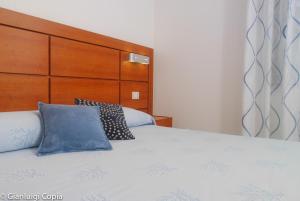 a bed with two pillows on top of it at Villaggio Turistico La Mantinera - Appartamenti de Luxe in Praia a Mare +62 photos