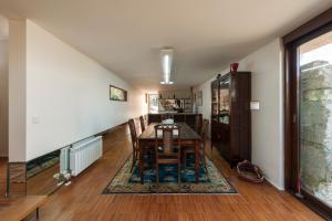a dining room with a table and some chairs at Casa do Sobreiro in Pedroso
