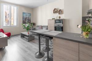 a kitchen and living room with a large counter top at My rima in Antibes
