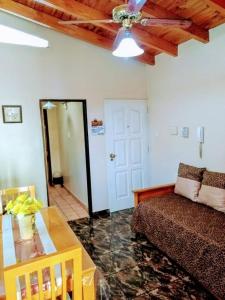 a living room with a couch and a table at Bombal Departamentos in Mendoza