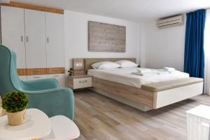 Postel nebo postele na pokoji v ubytování La Perla Apartments