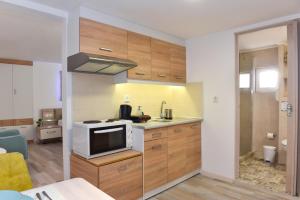 Kuchyň nebo kuchyňský kout v ubytování La Perla Apartments
