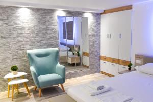 Postel nebo postele na pokoji v ubytování La Perla Apartments