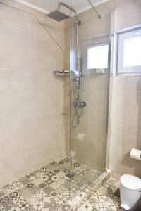Koupelna v ubytování La Perla Apartments