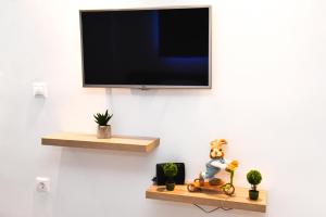TV a/nebo společenská místnost v ubytování La Perla Apartments