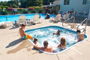 a group of people in a swimming pool at Sierra Sands Family Lodge in Mears