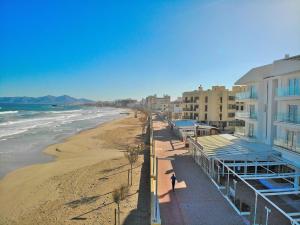 a view of a beach with buildings and the ocean at 146 Casa Starfish ETV6542 by Mallorca Charme in Can Picafort