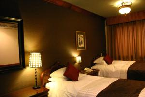 Postel nebo postele na pokoji v ubytování Hotel Gasthof