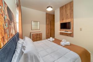 Postel nebo postele na pokoji v ubytování Amoudara Suites