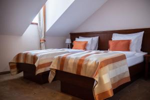 Posteľ alebo postele v izbe v ubytovaní Hotel Stara Lika