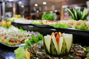 a buffet line with many plates of food at Hotel Puerto Palace in Puerto de la Cruz