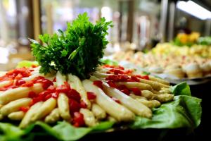 a plate of food with vegetables on a table at Hotel Puerto Palace in Puerto de la Cruz